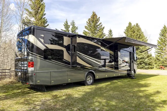 Motorhome parked on grass with its awning out