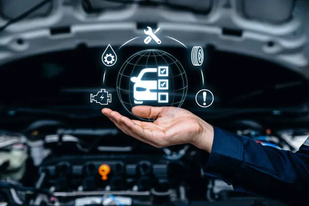 Technician checking a vehicle with a service checklist